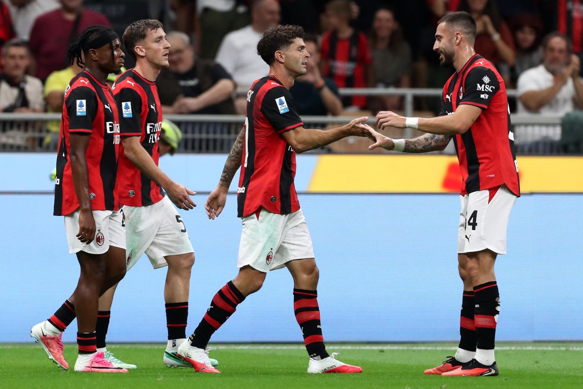 ITALY - SEPTEMBER 20: Christian Pulisic of AC Milan celebrates scoring his team’s first goal with teammate Mario Gila during the Serie A match between AC Milan and US Lecce at Stadio Giuseppe Meazza on September 20, 2026 in Italy. (Photo by Marco Luzzani/Getty Images)